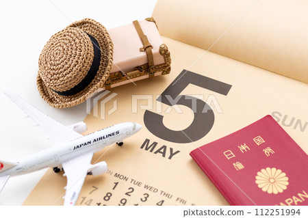 Travel bag trunk, airplane, passport, and May calendar Travel bag trunk, airplane, passport, and May calendar 112251994