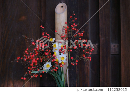 Takehara, Hiroshima Prefecture: The elegant bamboo flower tubes complement the old townscape. 112252015