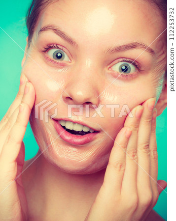 Woman in facial peel off mask. 112253732