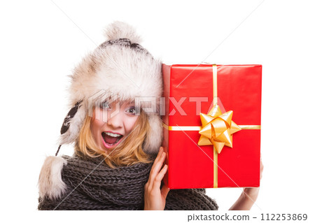 winter girl with red gift box isolated 112253869