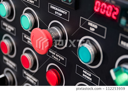 Red and green round lamps and buttons on black control panel Red and green round lamps and buttons on black control panel 112253939