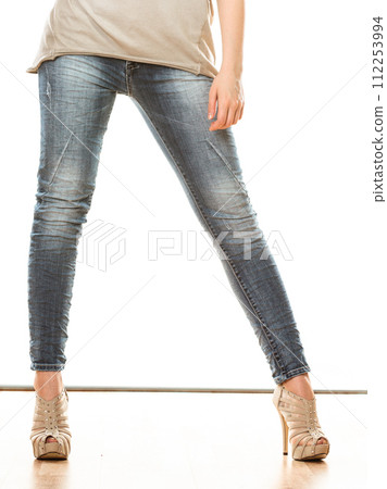 woman legs in denim trousers high heels shoes woman legs in denim trousers high heels shoes 112253994