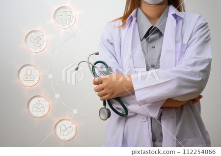 An unrecognizable doctor holding stethoscope standing on white background. Medical technology and health care concept 112254066