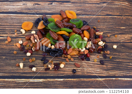 Dry fruits on wood 112254110