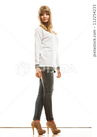 blonde fashionable woman in white shirt 112254233