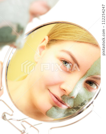 Skin care. Woman in clay mud mask on face. Beauty. Skin care. Woman in clay mud mask on face. Beauty. 112254247