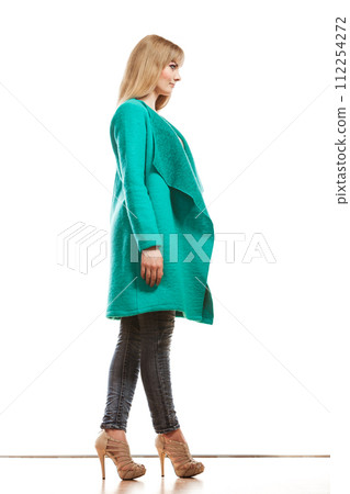 Full length fashion woman in green coat. Full length fashion woman in green coat. 112254272