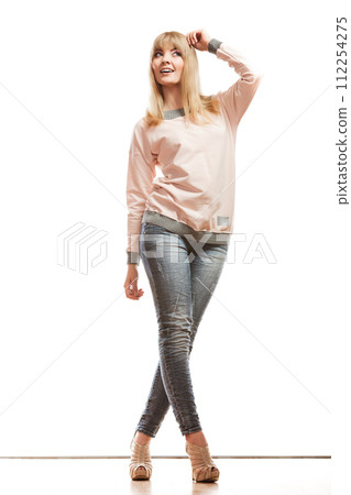 blonde fashion woman in shirt denim pants 112254275