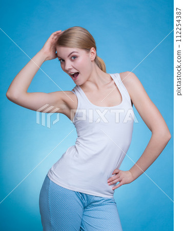 Young woman wearing pajamas, having fun Young woman wearing pajamas, having fun 112254387