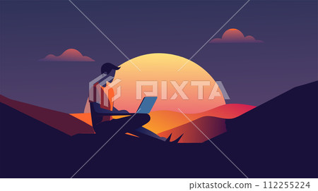 Freelancer working remotely on laptop during sunset 112255224