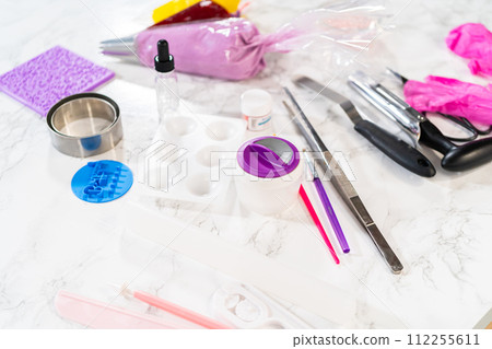 Artfully adorning the vanilla and chocolate cupcakes with delicate fondant pieces transforms them into festive treats suitable for a birthday celebration. Artfully adorning the vanilla and chocolate cupcakes with delicate fondant pieces transforms them into festive treats suitable for a birthday celebration. 112255611