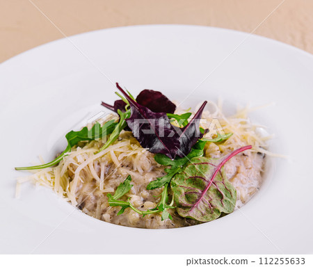 Risotto with arugula and parmesan cheese 112255633