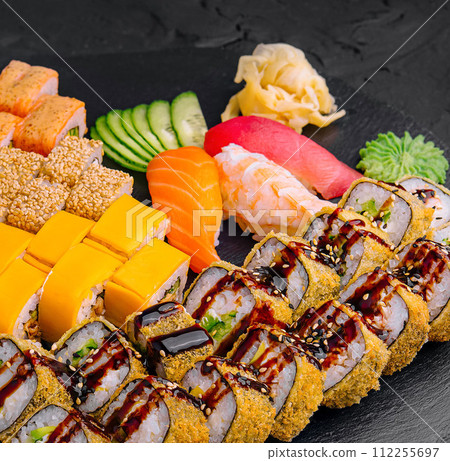 Sushi set on black stone background 112255697