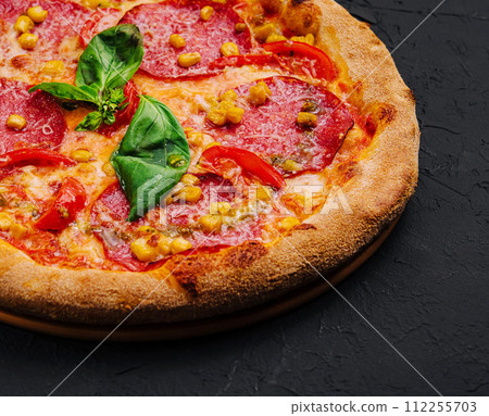 beautiful and tasty pepperoni pizza with corn 112255703