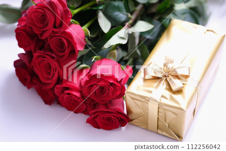Gift golden box for valentine day with red roses Gift golden box for valentine day with red roses 112256042