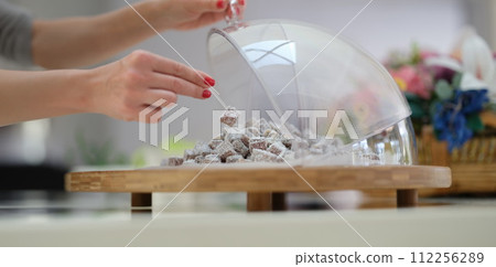 Hand selection of Turkish delight with coconut and pistachios on table. Hand selection of Turkish delight with coconut and pistachios on table. 112256289