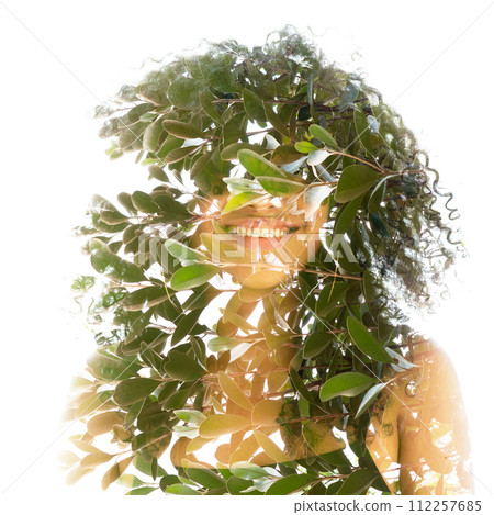 A full-front double exposure portrait of a young woman with frizzy hair A full-front double exposure portrait of a young woman with frizzy hair 112257685