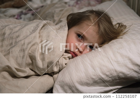 Child Falls Asleep. Peaceful Adorable Baby Sleeping at Home. Slumbering Little Toddler. Two Years Old Girl Sleeps. Nursery Room Interior Background. Serene Dream. Cute Face Close Up. Deep Kid Slumber Child Falls Asleep. Peaceful Adorable Baby Sleeping at Home. Slumbering Little Toddler. Two Years Old Girl Sleeps. Nursery Room Interior Background. Serene Dream. Cute Face Close Up. Deep Kid Slumber 112258107
