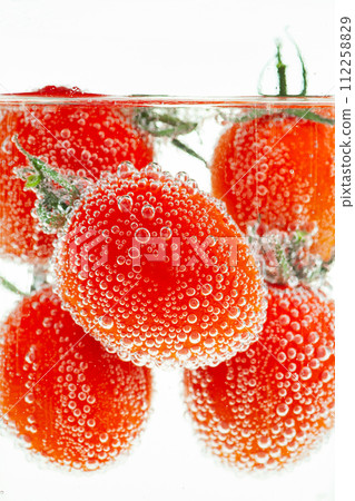 Cherry Tomatoes Floating in Water 112258829