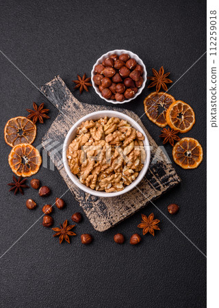 Delicious fresh peeled raw walnuts in a ceramic plate 112259018