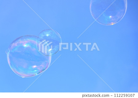 Bubbles floating in the blue sky Bubbles floating in the blue sky 112259107
