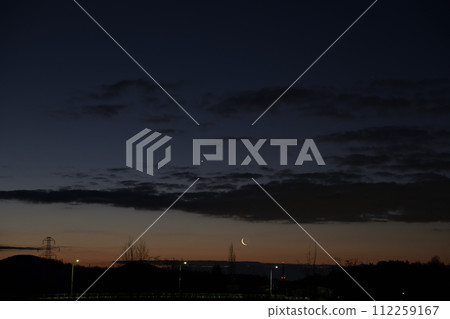 The morning star and the dawn moon rising in the dawn sky 112259167