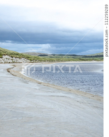 Sand storm at Dooey beach by Lettermacaward in County Donegal - Ireland Sand storm at Dooey beach by Lettermacaward in County Donegal - Ireland 112259289