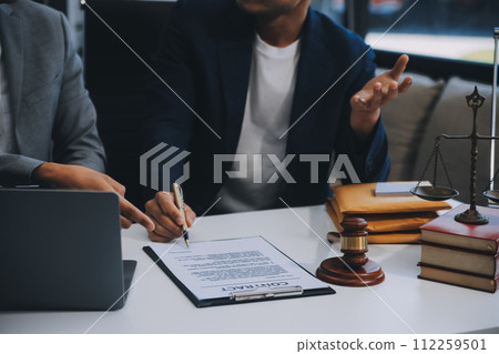 Consultation and conference of Male lawyers and professional businesswoman working and discussion having at law firm in office. Concepts of law, Judge gavel with scales of justice. 112259501