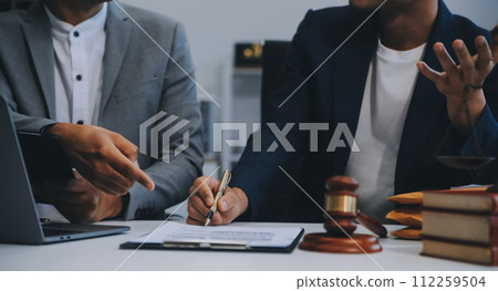 Consultation and conference of Male lawyers and professional businesswoman working and discussion having at law firm in office. Concepts of law, Judge gavel with scales of justice. 112259504
