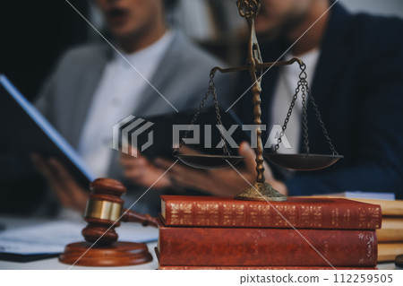 Consultation and conference of Male lawyers and professional businesswoman working and discussion having at law firm in office. Concepts of law, Judge gavel with scales of justice. 112259505