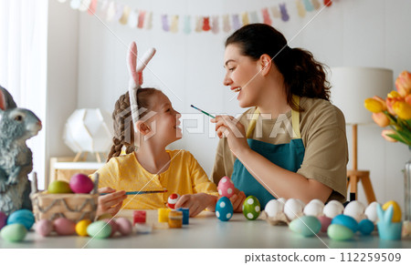 family preparing for Easter 112259509