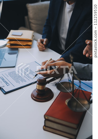 Consultation and conference of Male lawyers and professional businesswoman working and discussion having at law firm in office. Concepts of law, Judge gavel with scales of justice. 112259510