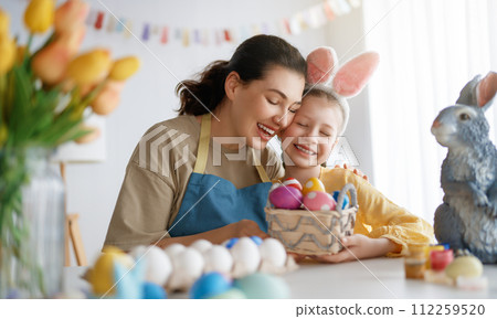family preparing for Easter 112259520