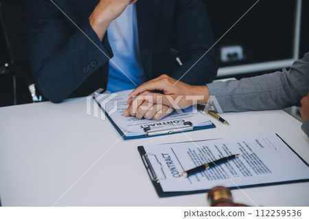 Consultation and conference of Male lawyers and professional businesswoman working and discussion having at law firm in office. Concepts of law, Judge gavel with scales of justice. 112259536