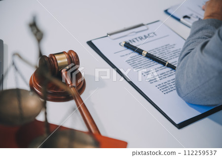 Consultation and conference of Male lawyers and professional businesswoman working and discussion having at law firm in office. Concepts of law, Judge gavel with scales of justice. 112259537