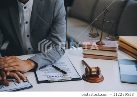Consultation and conference of Male lawyers and professional businesswoman working and discussion having at law firm in office. Concepts of law, Judge gavel with scales of justice. 112259538