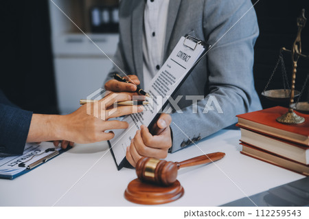 Consultation and conference of Male lawyers and professional businesswoman working and discussion having at law firm in office. Concepts of law, Judge gavel with scales of justice. Consultation and conference of Male lawyers and professional businesswoman working and discussion having at law firm in office. Concepts of law, Judge gavel with scales of justice. 112259543