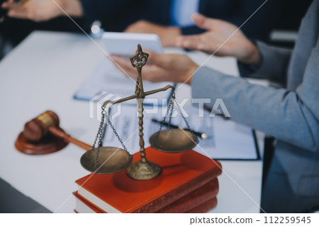 Consultation and conference of Male lawyers and professional businesswoman working and discussion having at law firm in office. Concepts of law, Judge gavel with scales of justice. 112259545