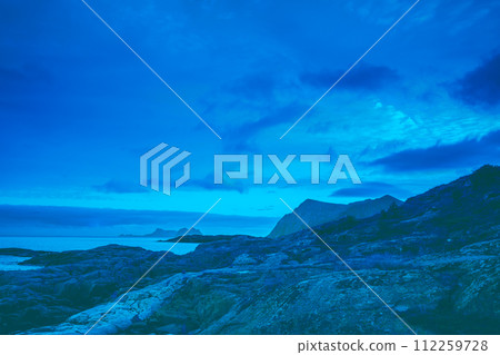 Beautiful rocky seascape in the evening. Blue toned. Wilderness of Norway, Lofoten islands 112259728
