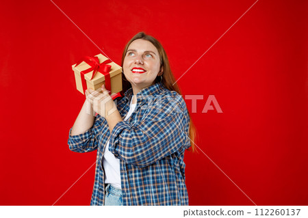 Portrait of cheerful, happy woman receive gift, smiling excited. Girl holding wrapped present, celebrating birthday on red background. Valentine's Day Women's Day birthday holiday concept. Portrait of cheerful, happy woman receive gift, smiling excited. Girl holding wrapped present, celebrating birthday on red background. Valentine's Day Women's Day birthday holiday concept. 112260137