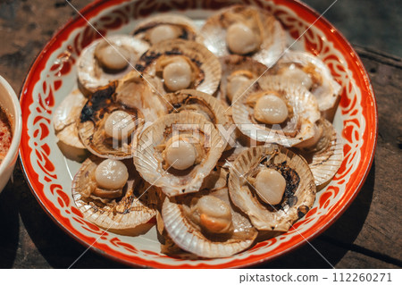 Grilled scallops on a platter Grilled scallops on a platter 112260271