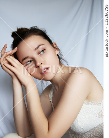 Gorgeous brunette woman with blue eyes, clear 112260759