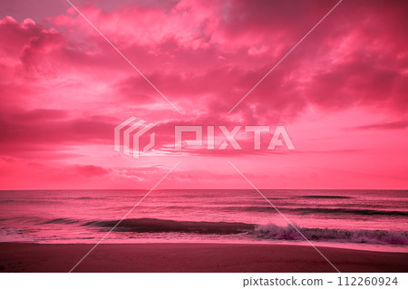 Seascape in the early morning in viva magenta trendy color. Sunrise over the sea. Nature landscape 112260924