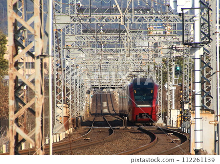 Hitotori limited express train on the Kintetsu Nara Line running through the World Heritage Heijo Palace ruins 112261139