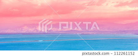 Dead Sea beach. Seascape during sunrise. Salt sea coast in Israel. View of Mount in Jordan. Gradient Color. Horizontal Banner 112261152