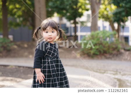 cute little girl playing in the park cute little girl playing in the park 112262161