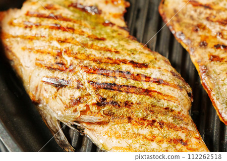 Grilled Salmon Fillets Unleashing Flavorful Melodies, close up 112262518