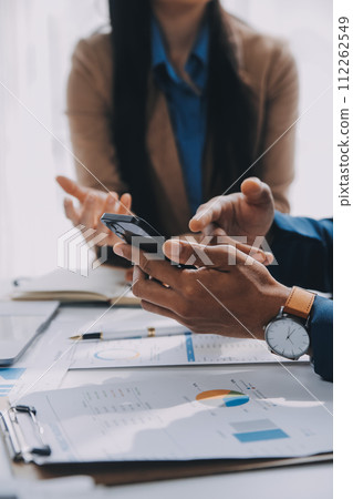 Business team working with new startup project plan and discussion information for financial strategy with laptop and digital tablet in a modern business lounge. 112262549