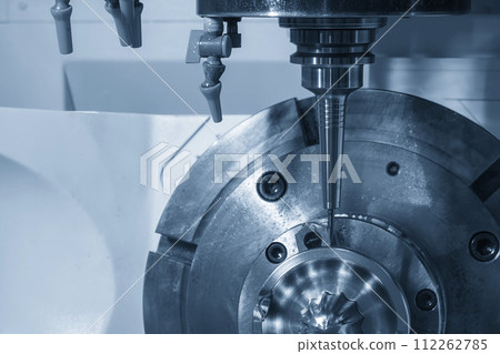 The 5-axis CNC milling machine  cutting the automotive part with solid ball end mill tool in the light blue scene. 112262785