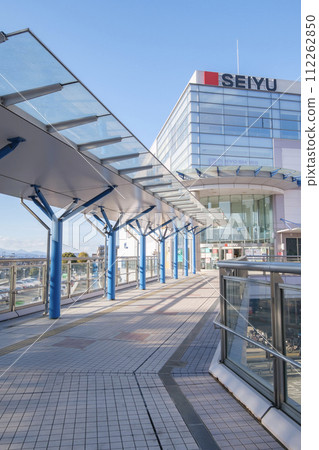Fussa Station pedestrian deck and cityscape in front of the east exit, Fussa City, Tokyo 112262850